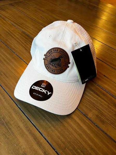 White low profile relaxed trucker hat with quail patch